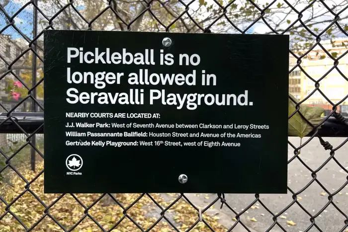 A sign banning pickleball at Cpl. John A. Seravalli Playground is posted at the park's entrance.